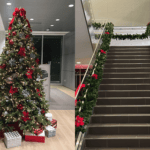 commercial building entrance decorated with holiday lights and wreaths and trees in chicago